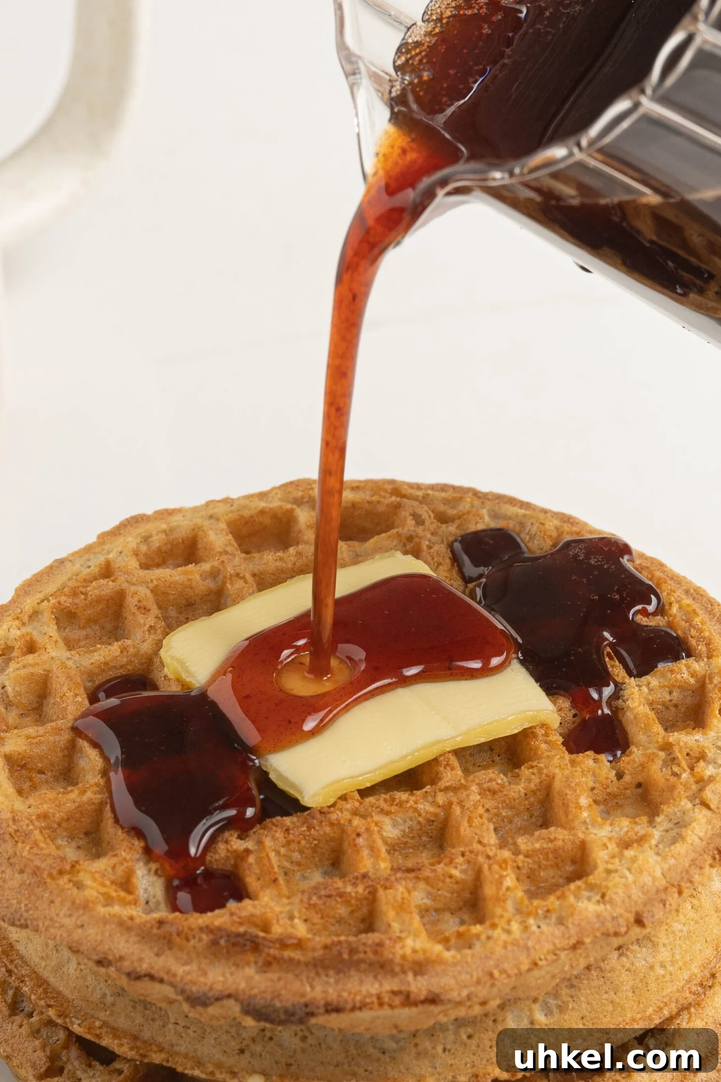 date syrup pouring over waffles