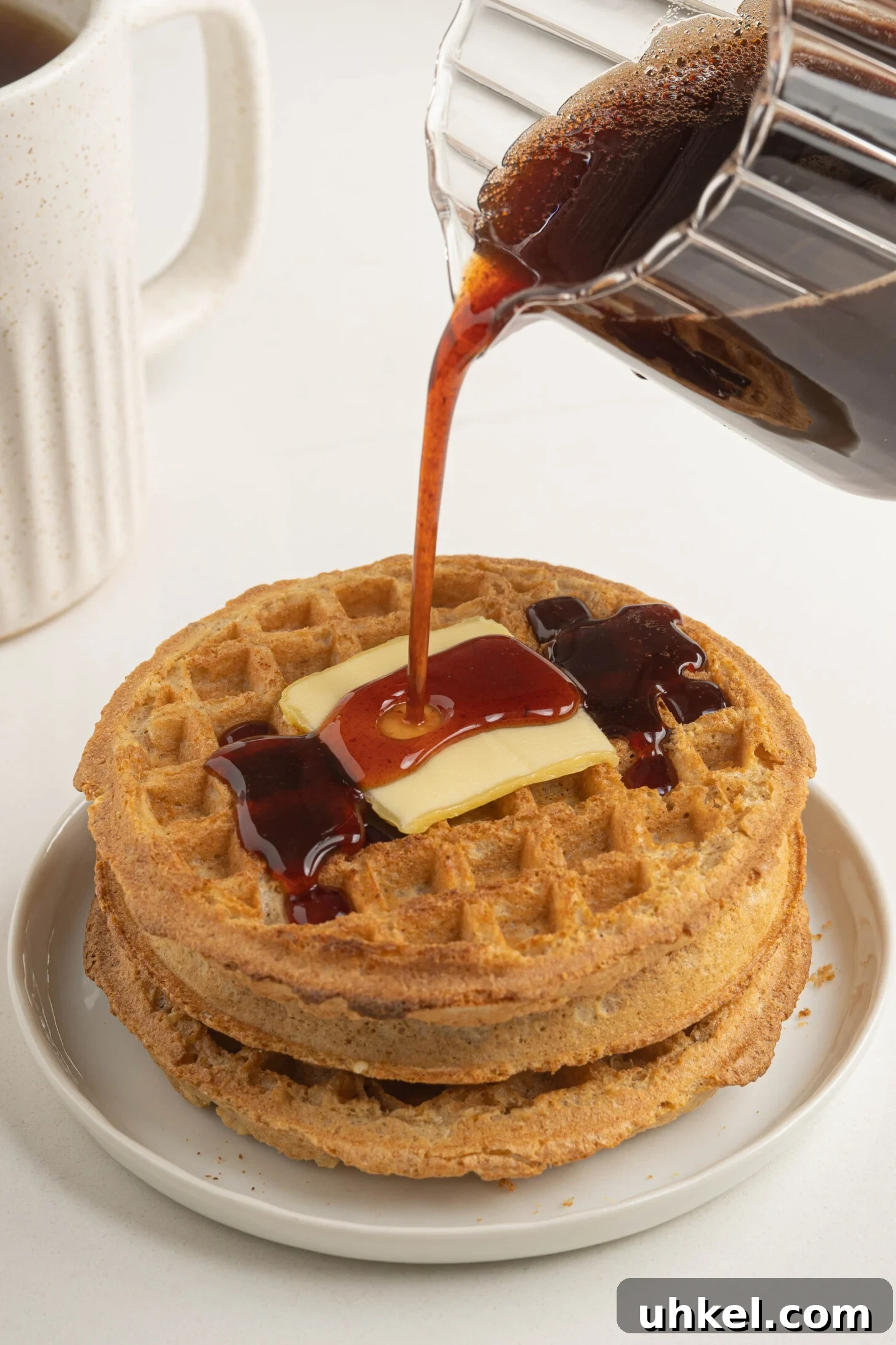 date syrup pouring over waffles
