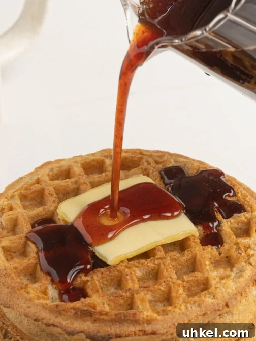 date syrup pouring over waffles