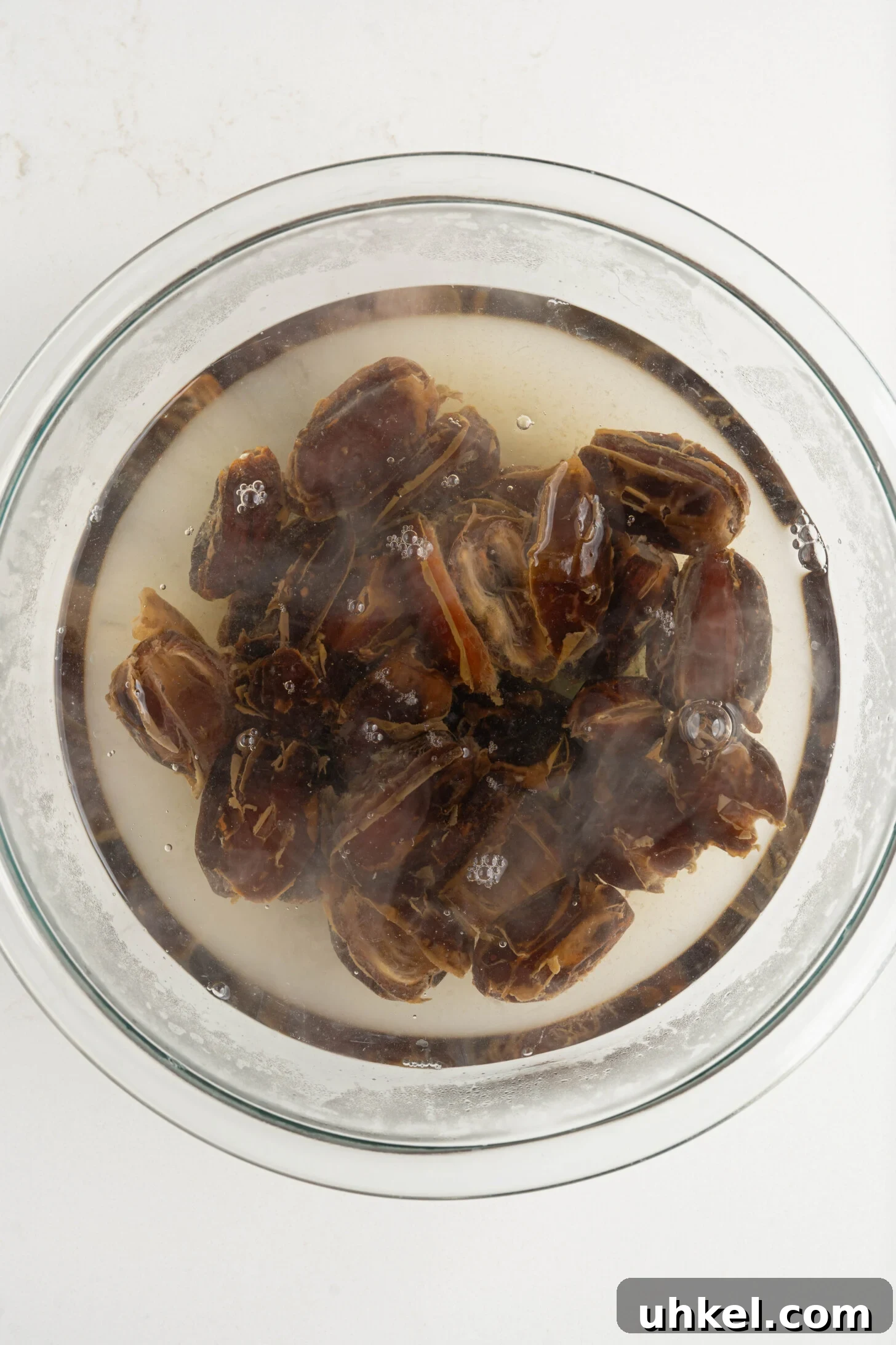 dates steeping in a bowl of water