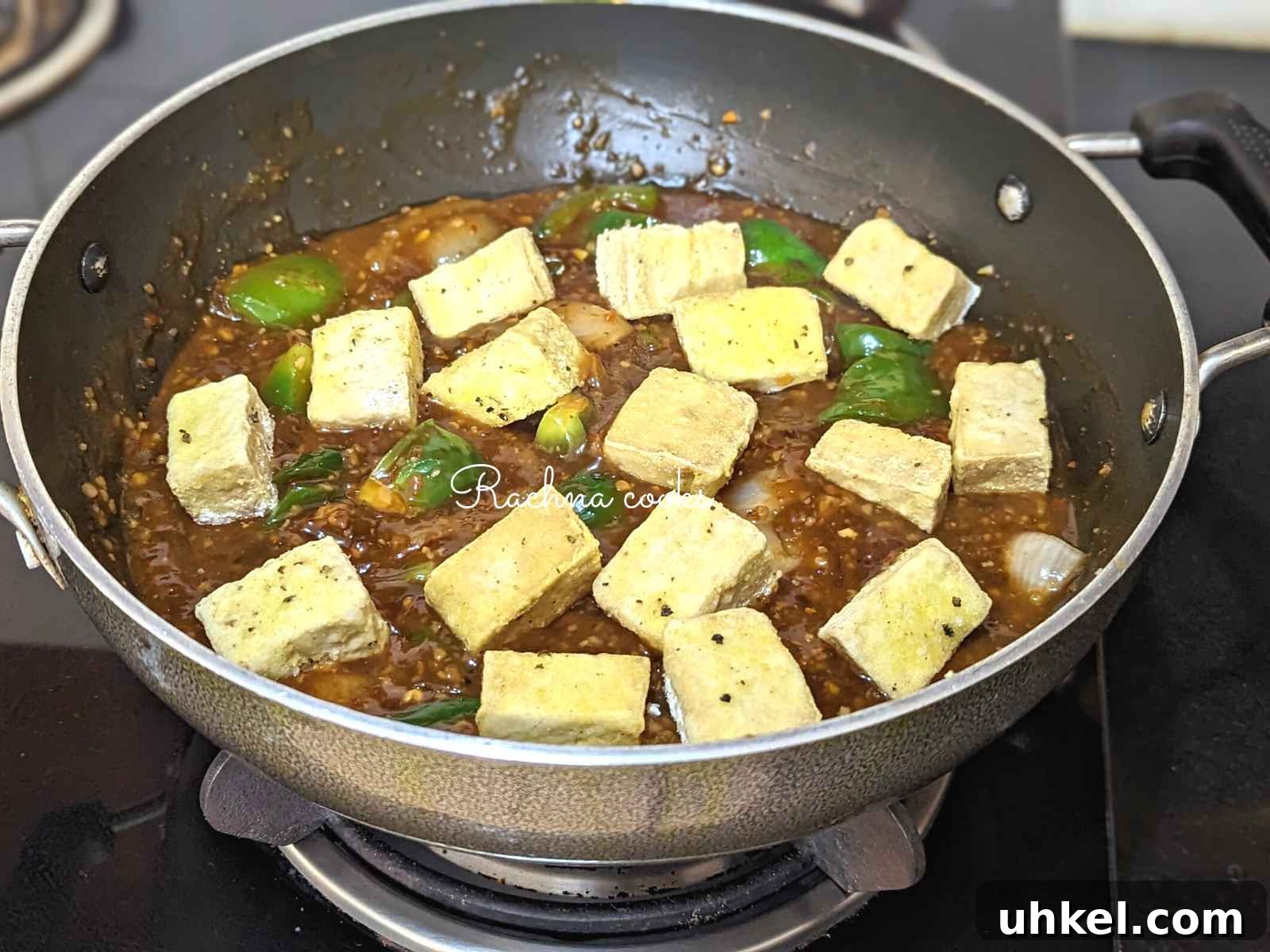 Crispy Tofu Manchurian with Spicy Indo-Chinese Sauce 10 Crispy tofu added to manchurian sauce in the pan.