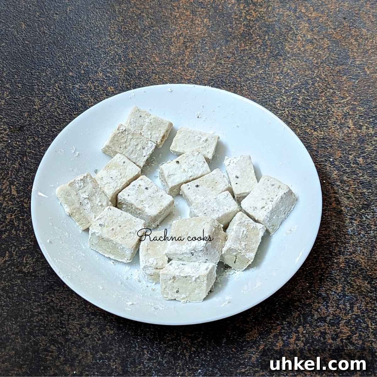 Crispy Tofu Manchurian with Spicy Indo-Chinese Sauce 7 Tofu cubes coated in cornstarch, salt and pepper.