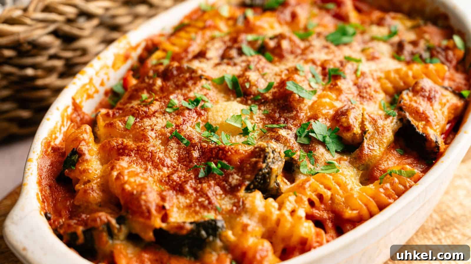 23 Spring Dinner Recipes to Lighten Up Heavy Weeknight Meals 23 Baked pasta casserole with rotini noodles, tomato sauce, melted cheese, and chopped parsley in a white dish.