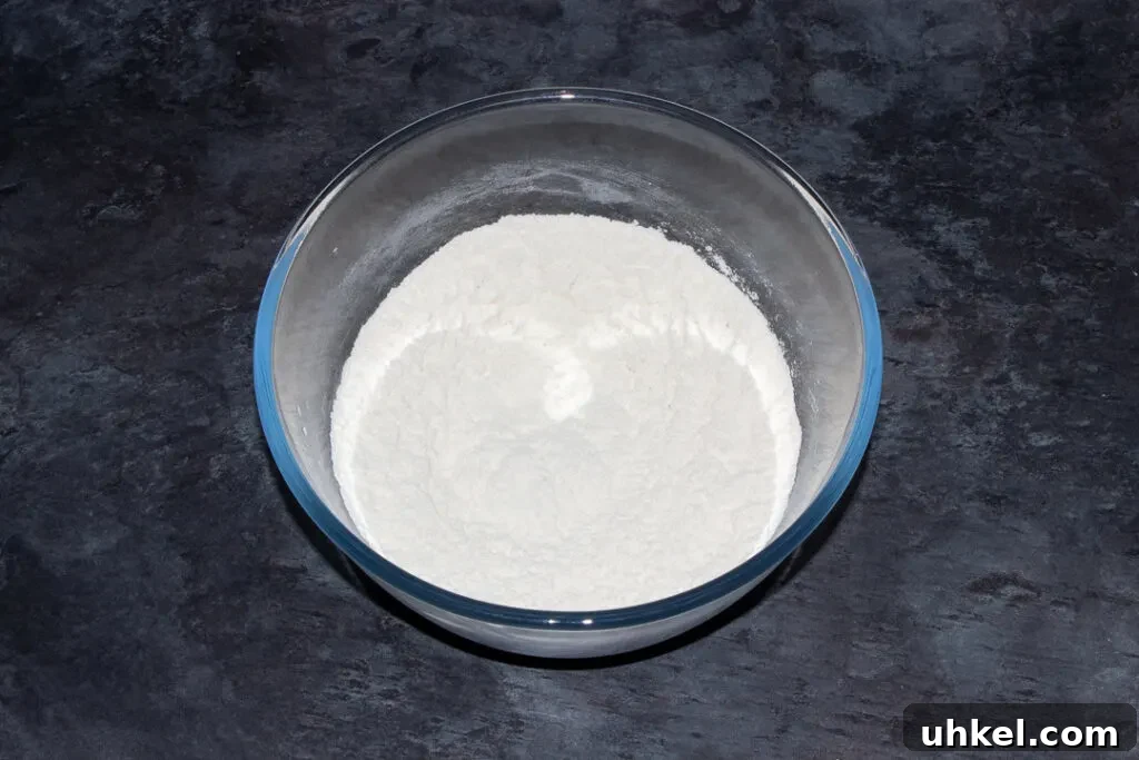 flour and salt mixed together in a large glass mixing bowl