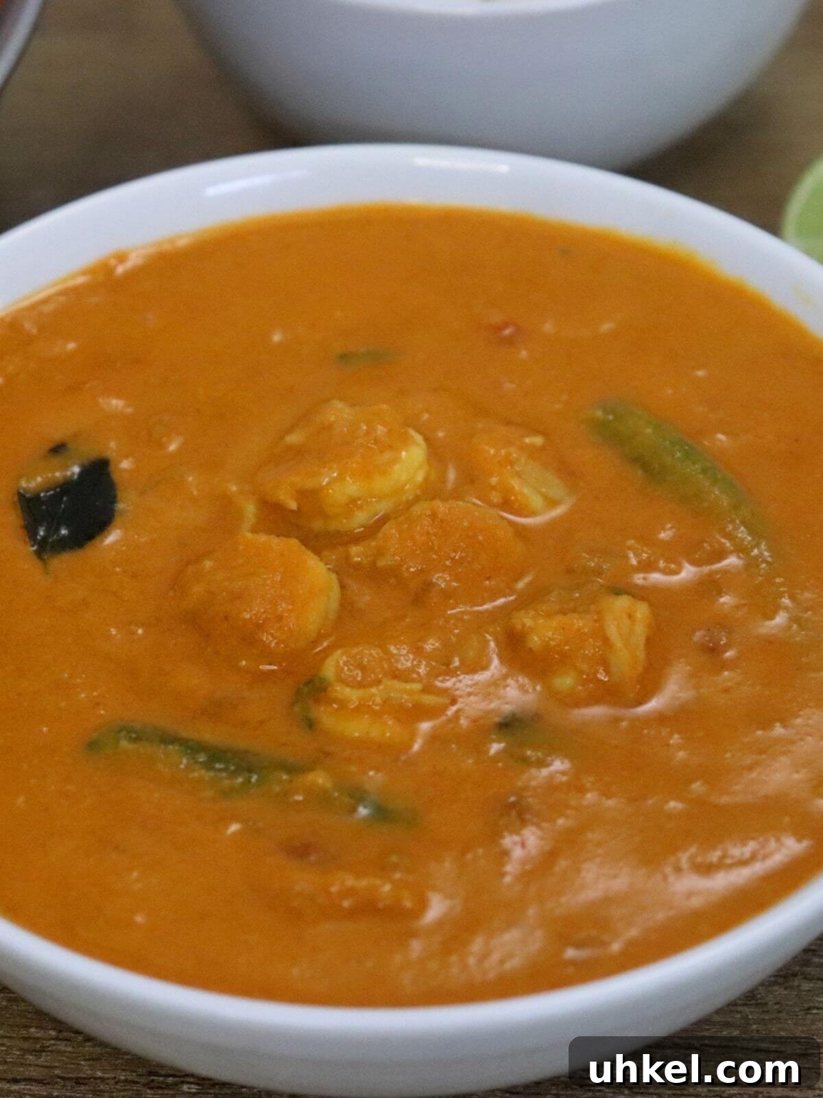 close-up of goan prawn curry recipe served in a white bowl.