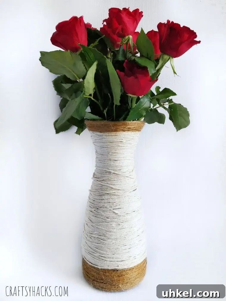 31 Cozy Winter Home Decor Ideas to Refresh Every Room 22 yarn wrapped glass vase