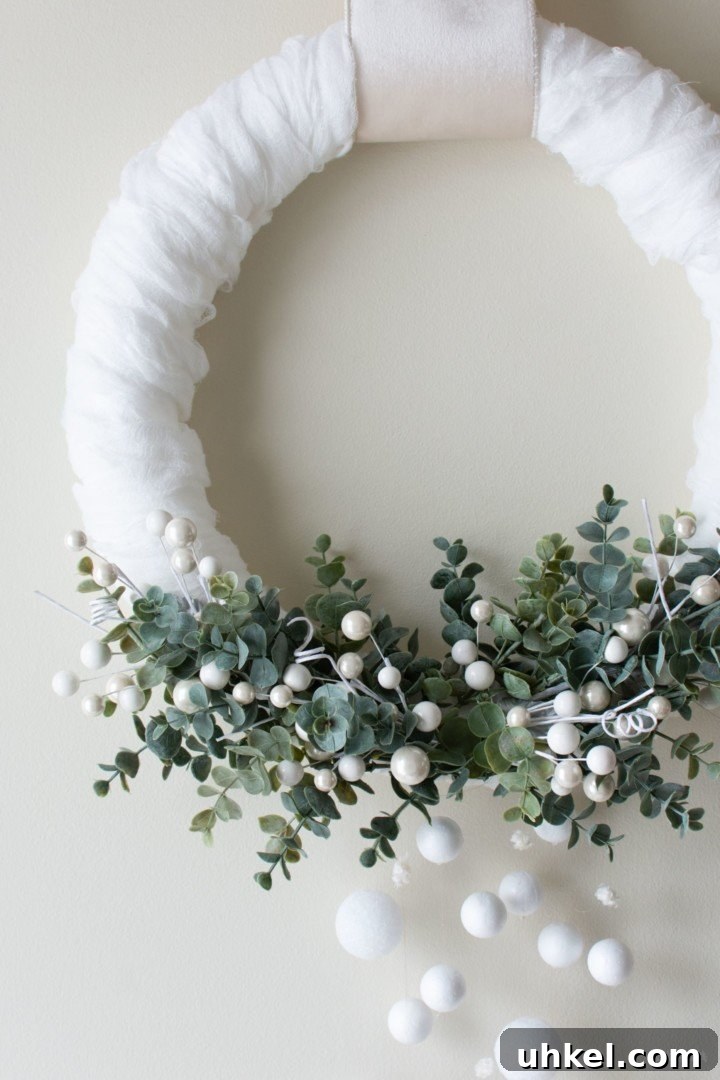 31 Cozy Winter Home Decor Ideas to Refresh Every Room 33 wintergreen wreath