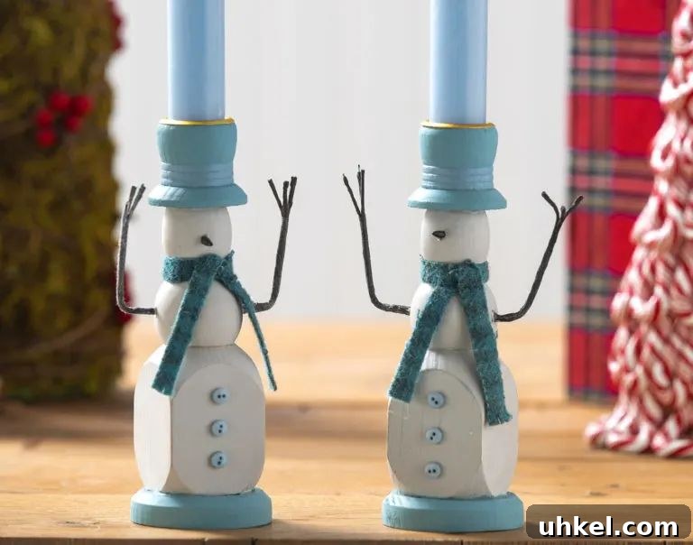 31 Cozy Winter Home Decor Ideas to Refresh Every Room 6 snowman candlestick holders