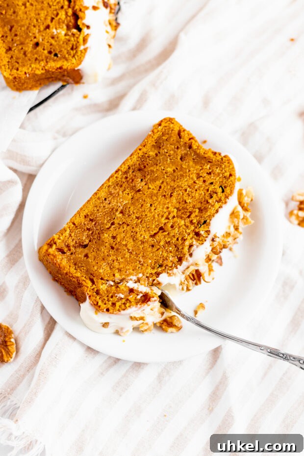 Ultimate Pumpkin Bread Recipe: Moist Spiced Loaf for Fall 4 The Best Pumpkin Bread sliced on a plate.