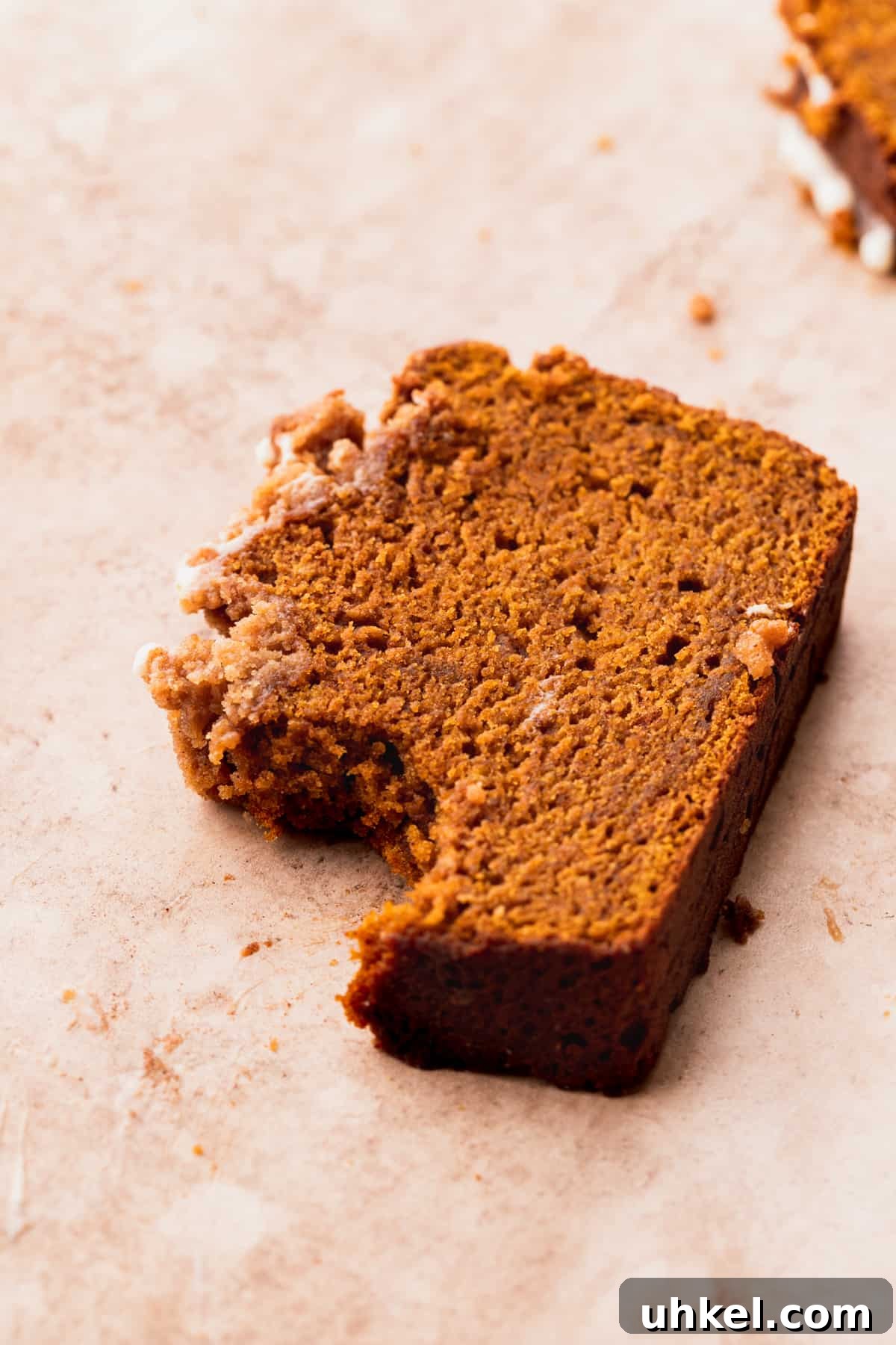 Pumpkin Bread with Cream Cheese Frosting Recipe and Tips 3 A bite missing from pumpkin bread with cream cheese frosting.