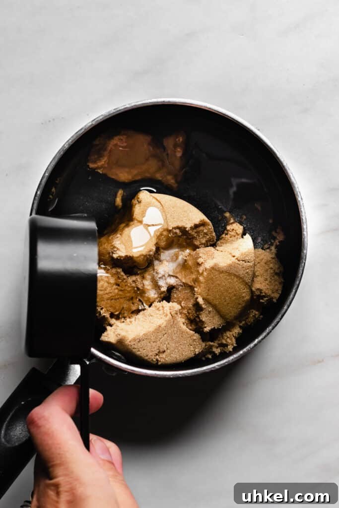 Build a DIY S'mores Bar for the Perfect Party Dessert 7 Adding corn syrup to brown sugar and water.