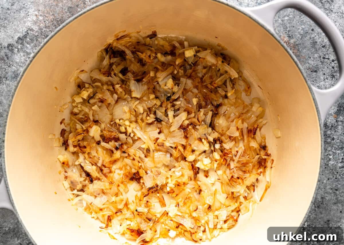 Traditional Hungarian Goulash Recipe: Hearty Beef Stew Guide 5 overhead process shot: sautéing onion and garlic