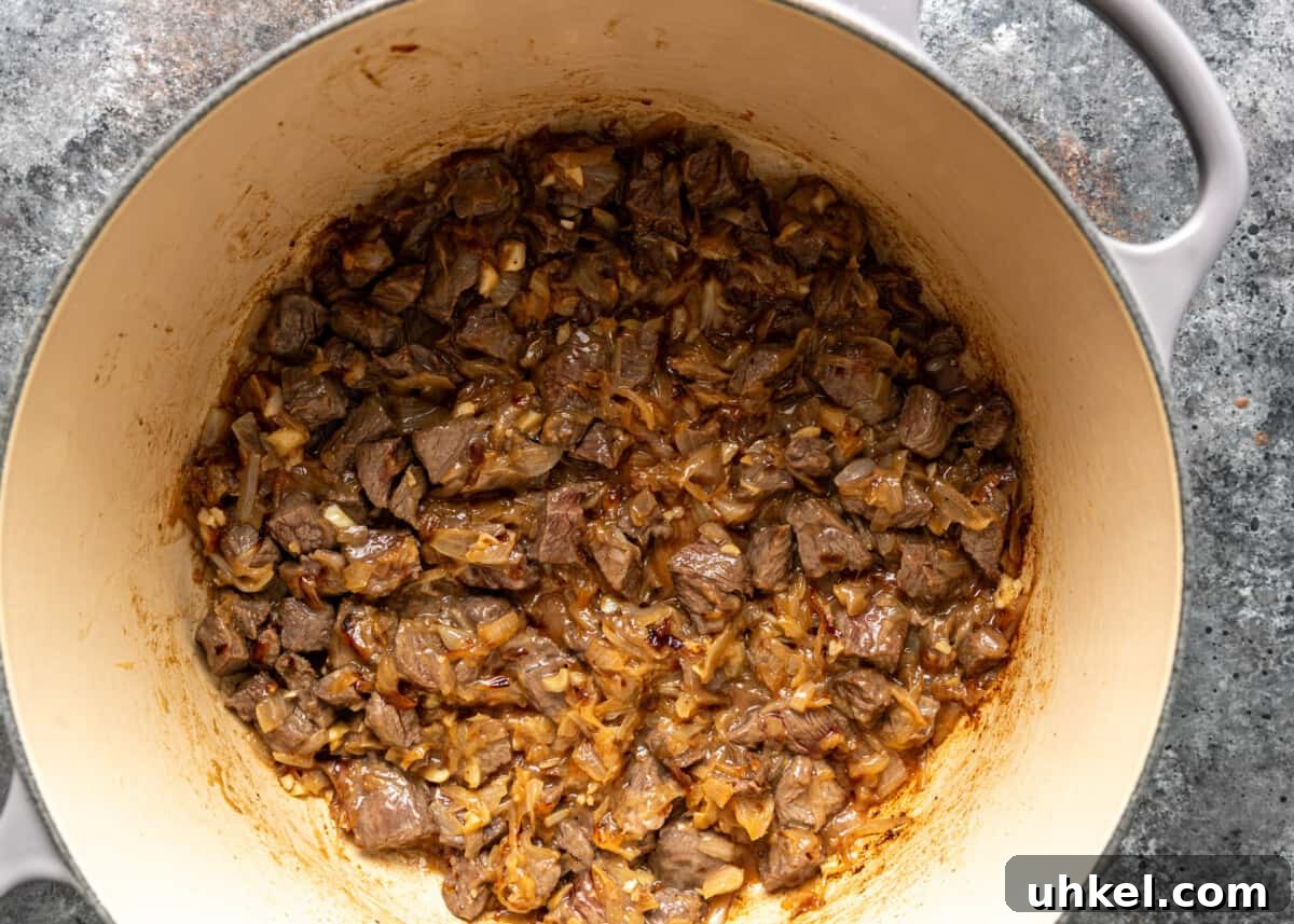 Traditional Hungarian Goulash Recipe: Hearty Beef Stew Guide 6 browned beef with onion in pot