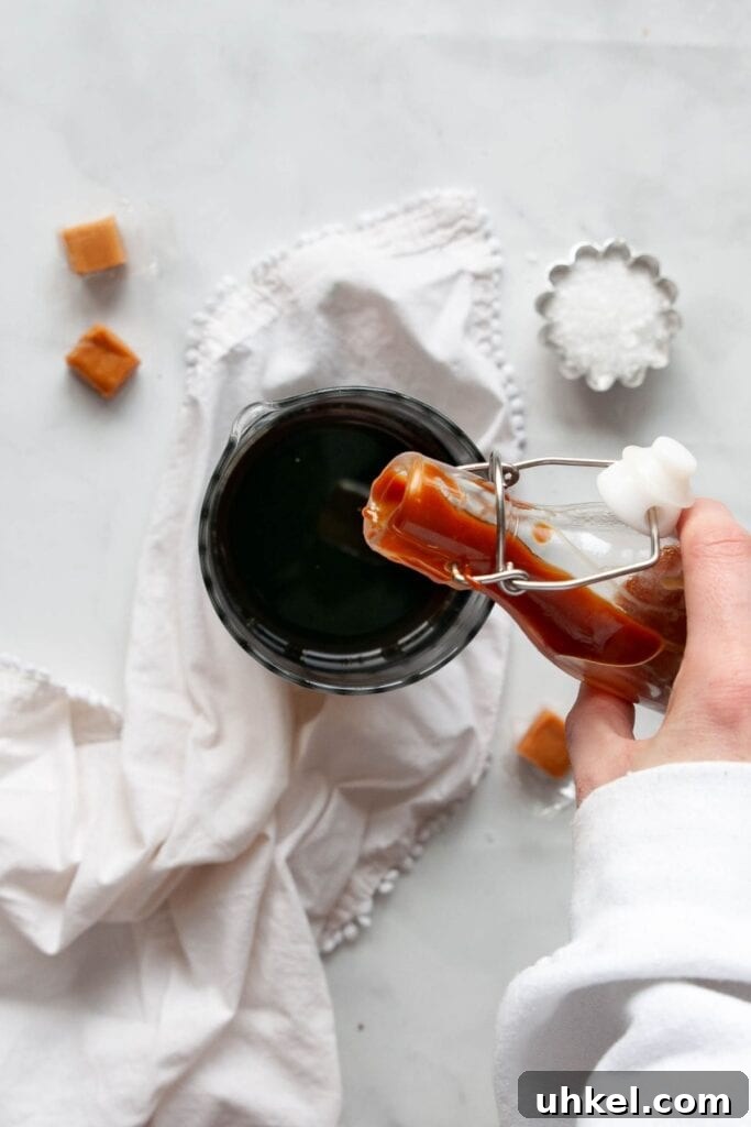 Starbucks Salted Caramel Cream Cold Brew: Flavor & Nutrition Guide 4 pouring caramel sauce into cold brew