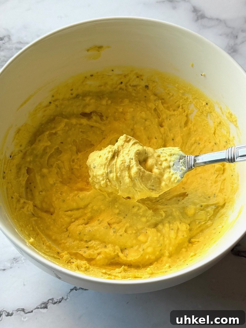 Classic Deviled Eggs Recipe for Gatherings 12 Smashed egg yolks combined with mayo, mustard, and black pepepr.