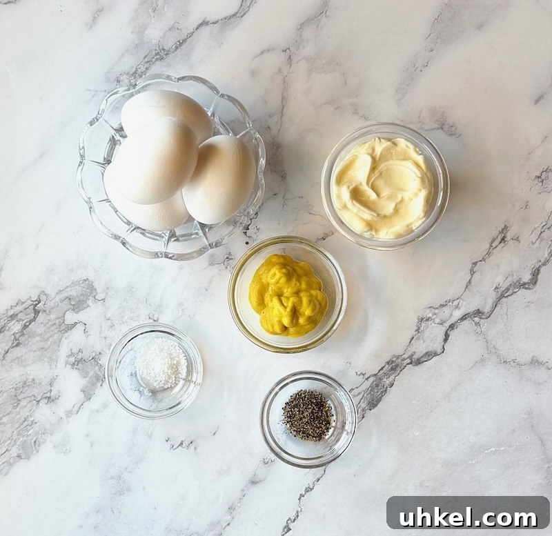 Classic Deviled Eggs Recipe for Gatherings 3 Ingredients displayed for Easy classic deviled eggs. Large white eggs, mayo, yellow mustard, salt and pepper