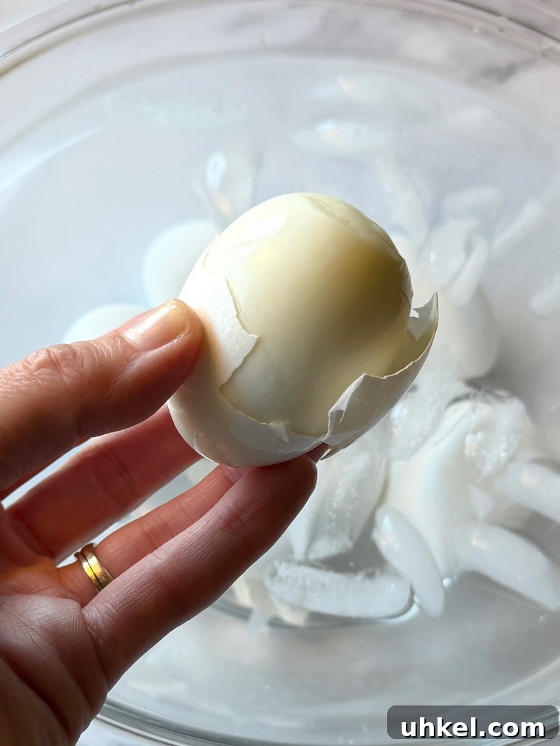 Classic Deviled Eggs Recipe for Gatherings 7 Hard boiled eggs with a peeled shell.