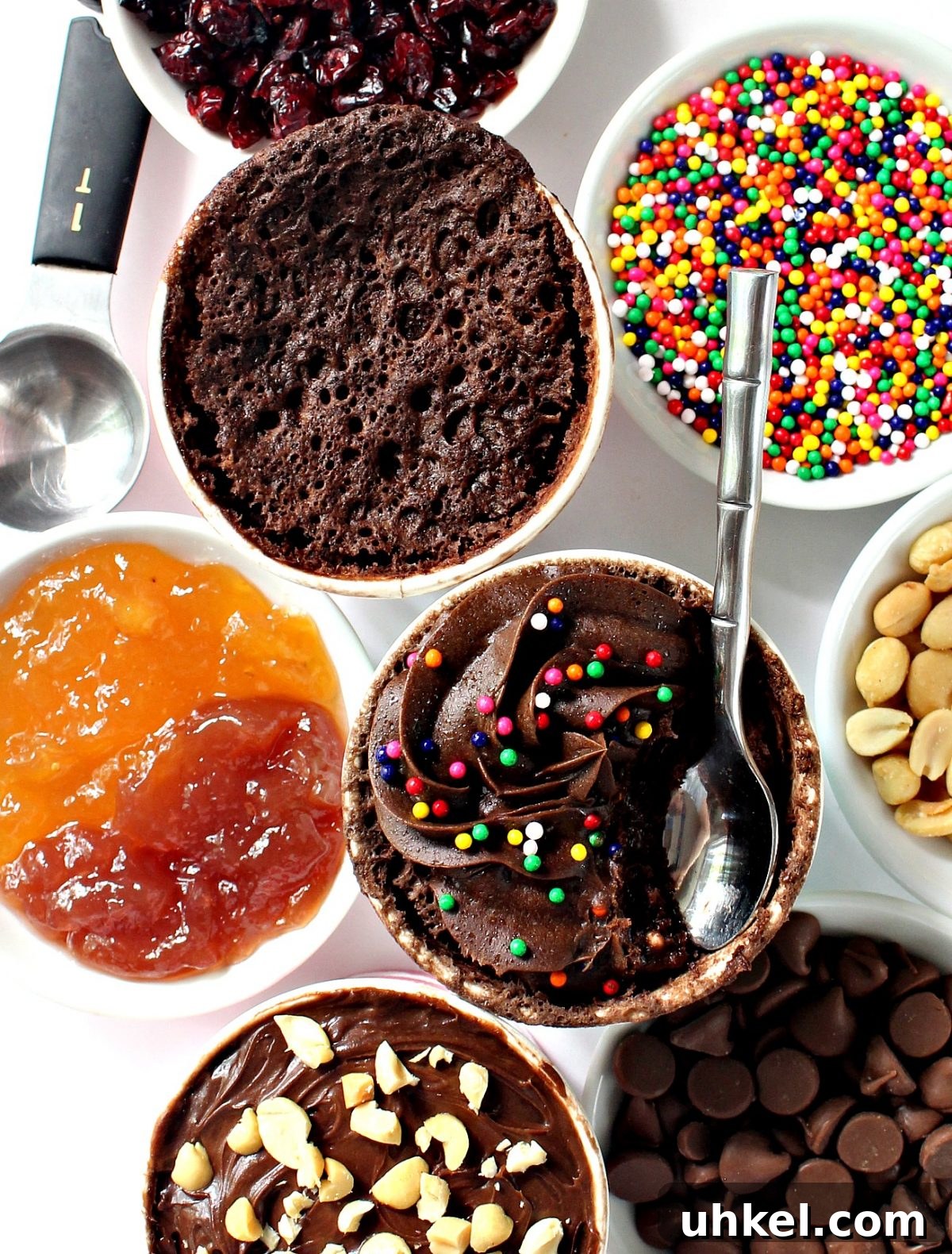 3-2-1 Magic Mug Cake with cake mix and no egg, cooks in the microwave in just 1 minute! Indulge in your own 321 cake or one of the 321 mug cake variations! Chocolate cake mix mug cakes with add-ins of dried fruit, sprinkles, peanuts, chocolate chips, jam.