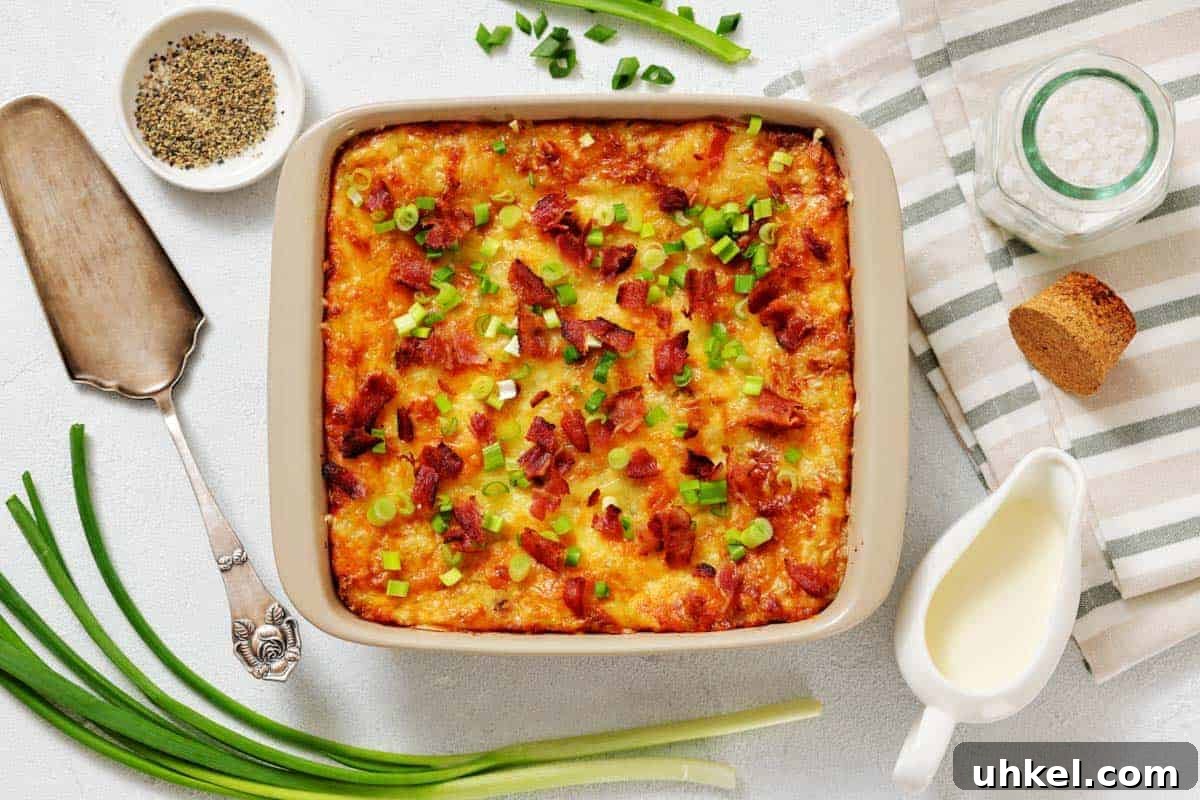 35 Timeless Southern Recipes That Always Delight 20 Grandma’s Twice-Baked Potato Casserole topped with chopped green onions and bacon, surrounded by fresh green onions.