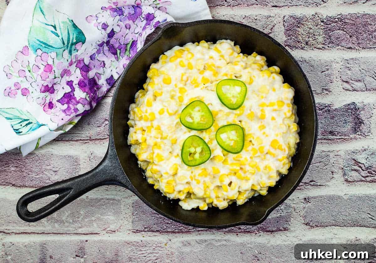 35 Timeless Southern Recipes That Always Delight 29 Smoked Creamed Corn in a black skillet.