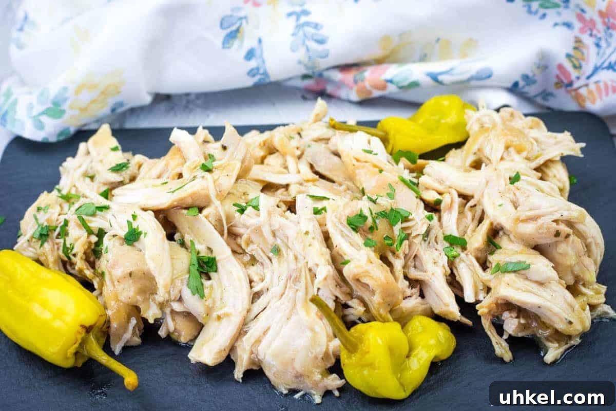 35 Timeless Southern Recipes That Always Delight 34 Low-Carb Mississippi Chicken garnished with parsley is served on a slate platter with yellow peppers.