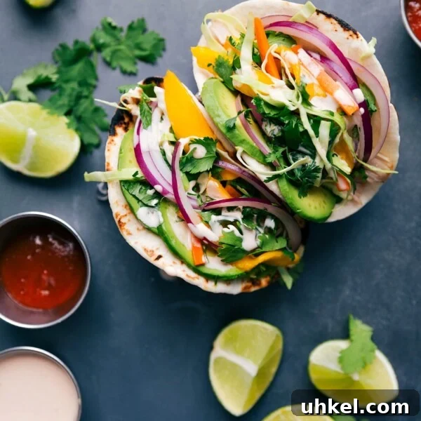 Authentic Korean Fried Chicken Recipe You Can Make at Home 5 Asian chicken tacos stuffed with chicken, vegetables, and a complementary sauce, ready to be enjoyed.