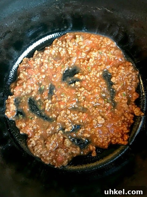 Slow-Cooker Ravioli Lasagna Recipe for Comforting Weeknight Meals 7 meat sauce in a crock pot