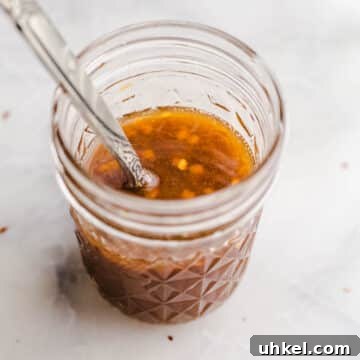 Gluten-Free Stir-Fry Sauce Recipe for Flavorful Quick Meals 11 A mason jar with tamari sauce.