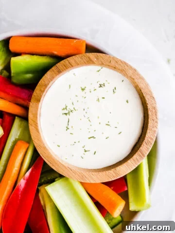 Ranch dressing in a bowl with vegetables