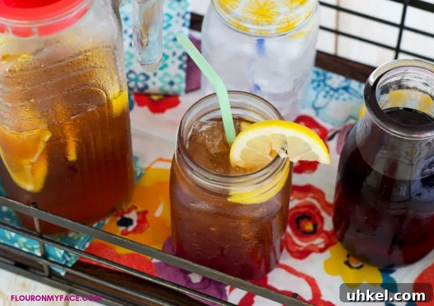 Refreshing Hibiscus Iced Tea Recipe for Summer (Simple Steps) 4 Pitcher and glass of Hibiscus Iced Tea with lemon