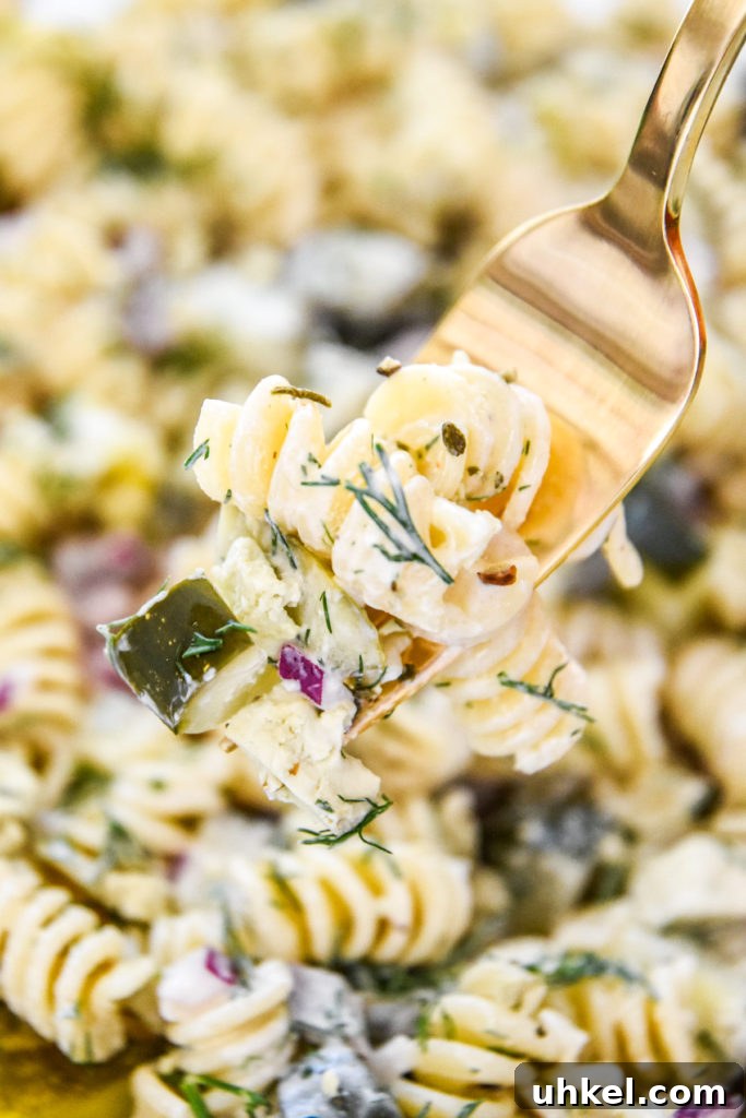 Creamy Dill Pickle Pasta Salad Recipe for Summer Potlucks 8 a forkful of creamy dill pickle pasta salad.