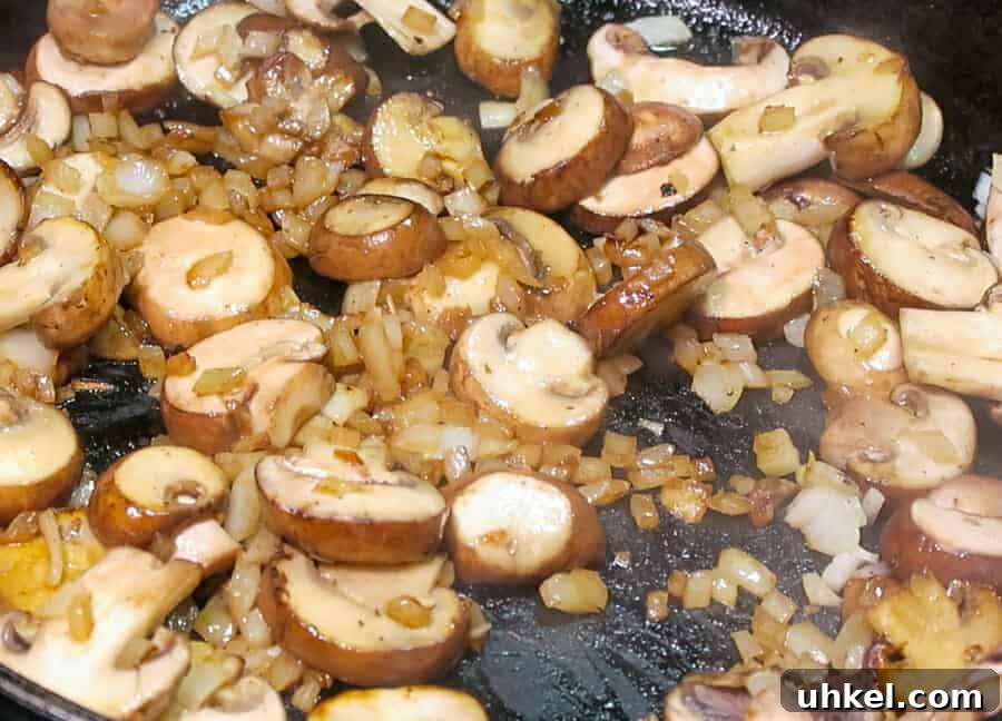Creamy Ground Beef Stroganoff with Greek Yogurt 7 sautéed onions and baby bella mushrooms for the
