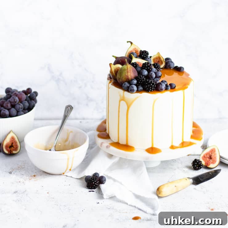 Top Fall Cakes to Bake This Season 7 sweet potato cake next to an empty bowl of caramel and a bowl of grapes