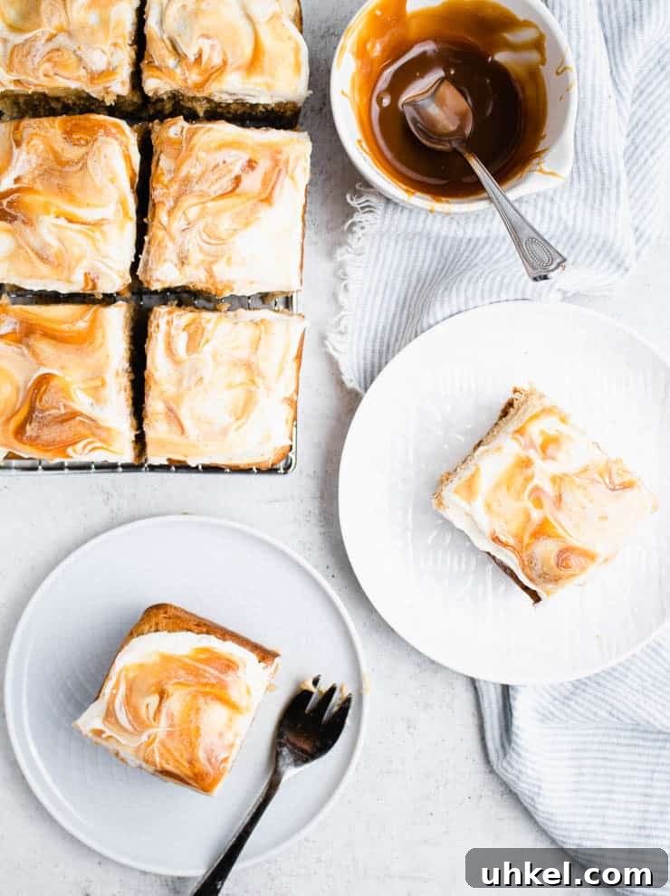 Top Fall Cakes to Bake This Season 8 overhead view of caramel apple cake on a cooling rack with plated slices of cake and a bowl of caramel around it.