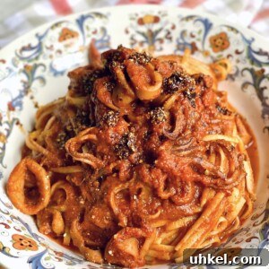 Spicy Calamari Fra Diavolo Pasta Recipe 10 Finished and styled Calamari Pasta in decorative bowl.