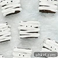 Gluten Free Mummy Brownies decorated for Halloween on crinkled wax paper