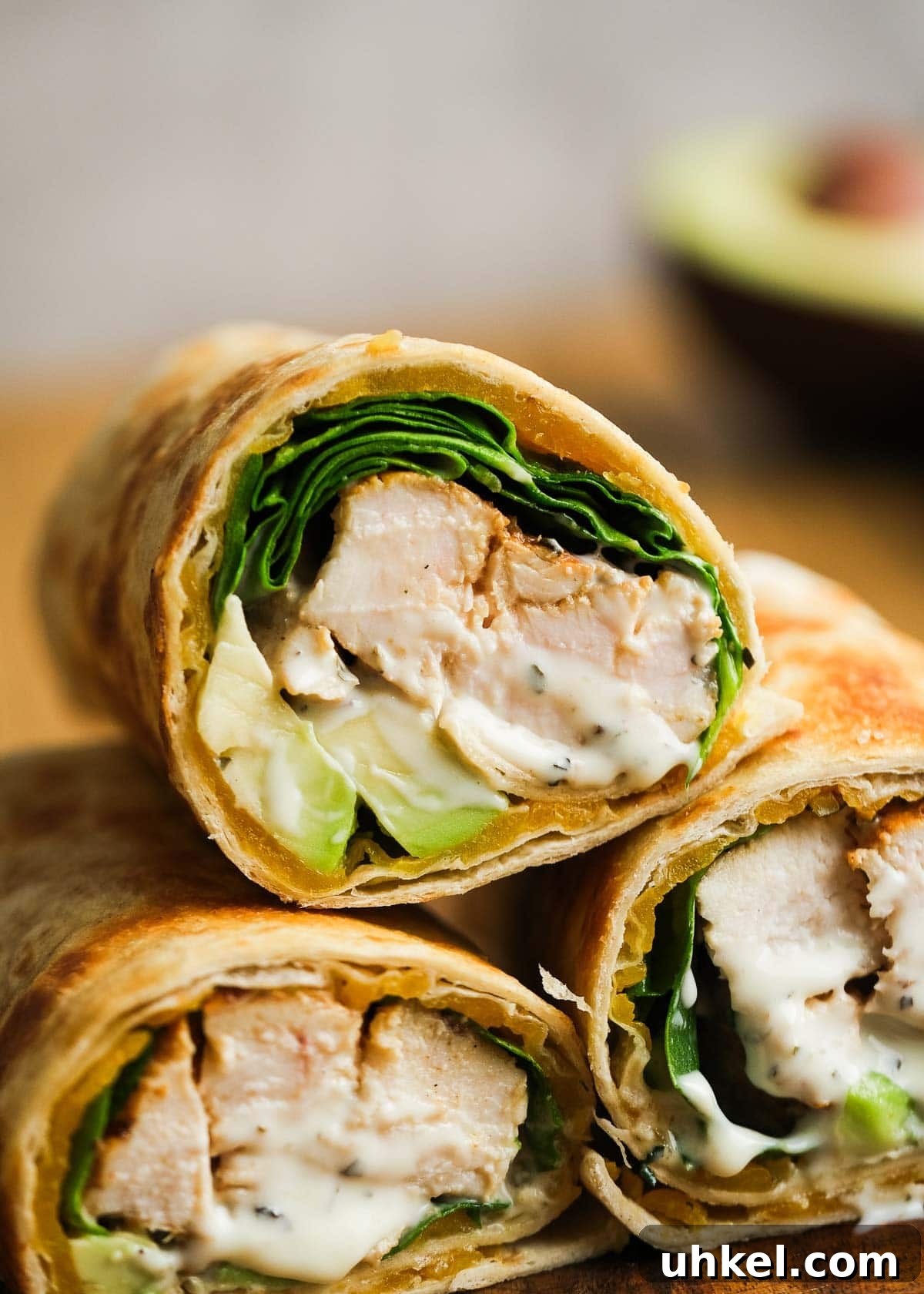 Chicken and Avocado Wrap Recipe for Quick Weeknight Meals 2 close up image of three chicken avocado wraps