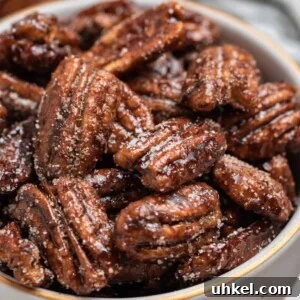 Sugar dusted maple pecans in bowl.