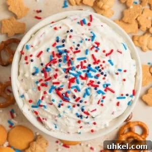 Overhead view of funfetti dip with red, white and blue sprinkles on top.