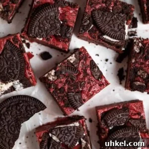 Overhead view of red velvet Oreo fudge with Oreos surrounding.