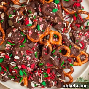 Overhead view of plate with dark chocolate candy cane pretzel bark.