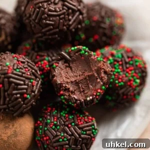 5 ingredient amaretto truffles on wax paper lined dish.