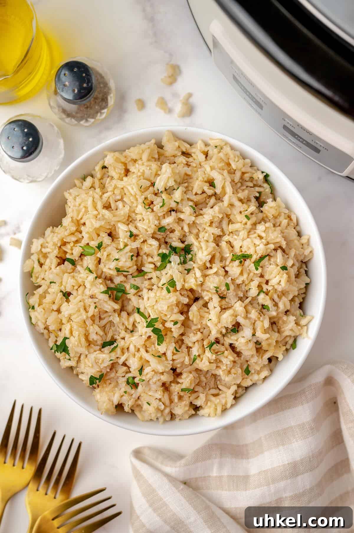 Slow Cooker Brown Rice: Perfect Crockpot Ratio for Fluffy Grains 2 Cooked brown rice in bowl made in the slow cooker.