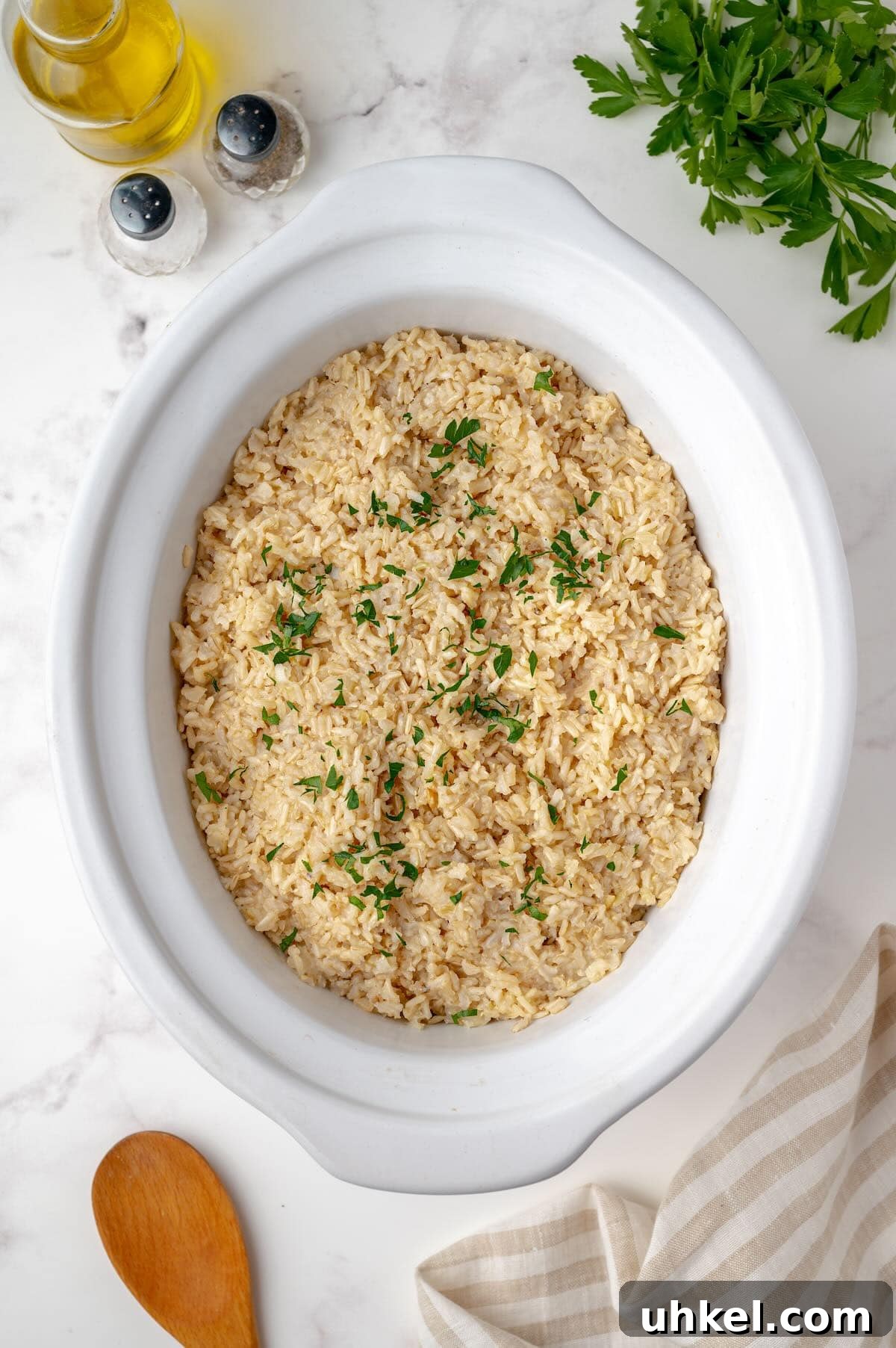 Slow Cooker Brown Rice: Perfect Crockpot Ratio for Fluffy Grains 4 Brown rice cooking in crockpot insert.