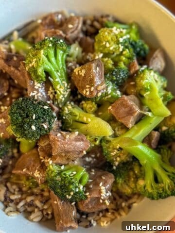 Crock pot beef and broccoli sprinkled with toasted sesame seeds.