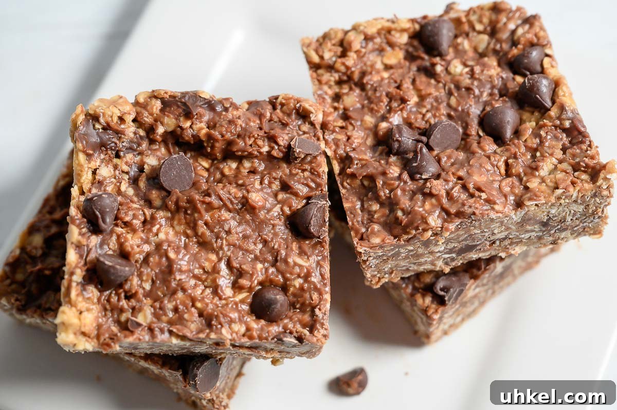 4-Ingredient Peanut Butter Oat Bars Recipe for Quick Snacks 5 4 Ingredient Peanut Butter Oat Bars in two stacks on a plate.