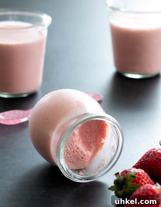 Whipped Jell-O Style Gelatin Dessert Recipe 6 A small jar of whipped strawberry jello on its side.