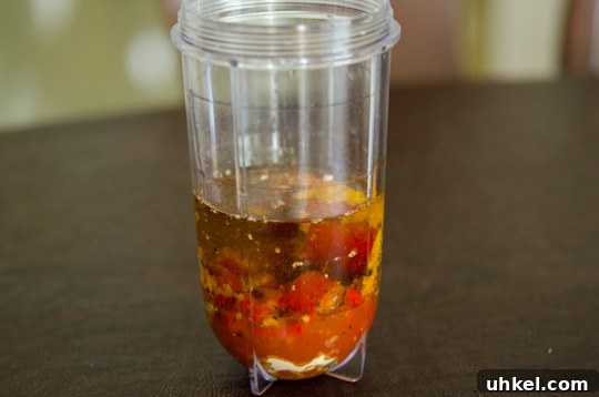 piri piri chicken-2 Chili and other ingredient for peri-peri sauce is combined in a mini blender.