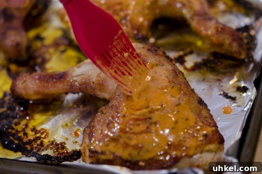 piri piri chicken-7 peri-peri sauce is brushed to roasted chicken legs