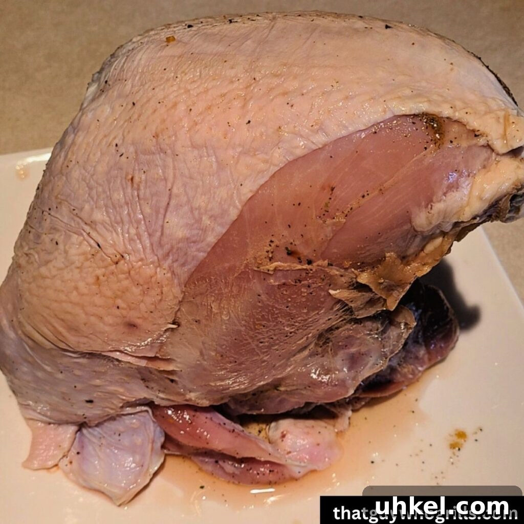 Perfect Turkey Breast Brine Recipe for Juicy, Flavorful Meat 4 Brined Turkey breast on white plate to chill before smoking